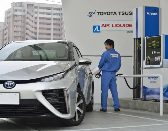 Man filling up Air Liquide car